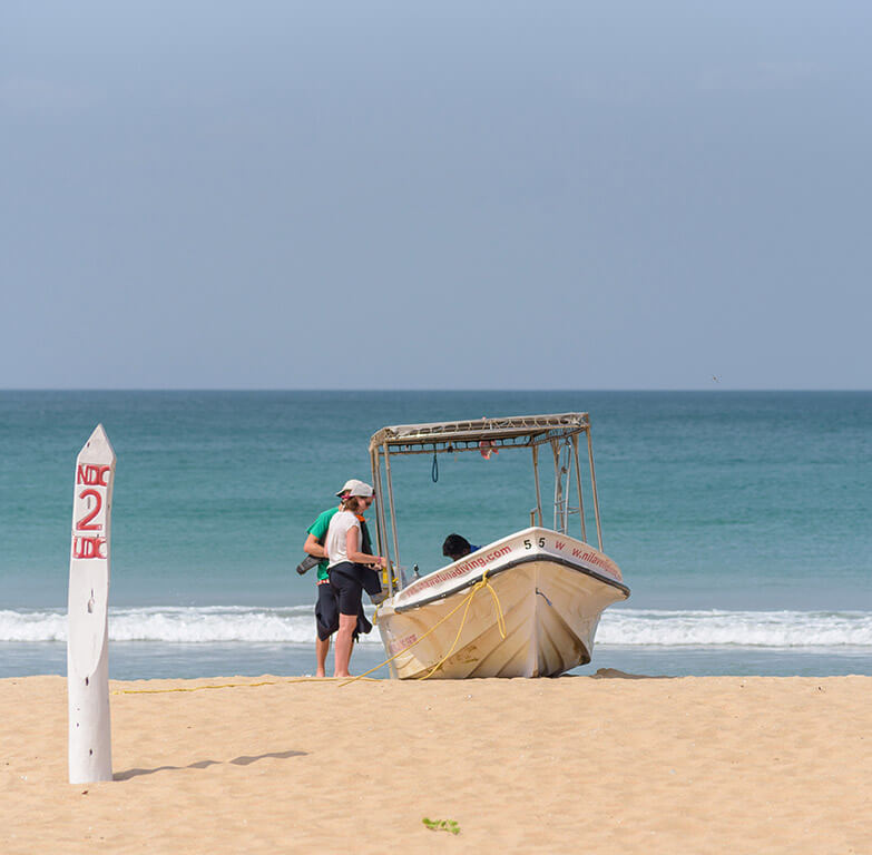 Preparing for dive Trip and loading scuba equipment to Divinguru diving boat in Nilaveli